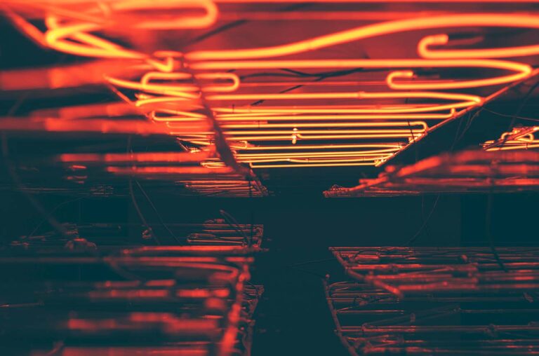 Modern small kitchen remodel showcasing open shelving and bright cabinetry